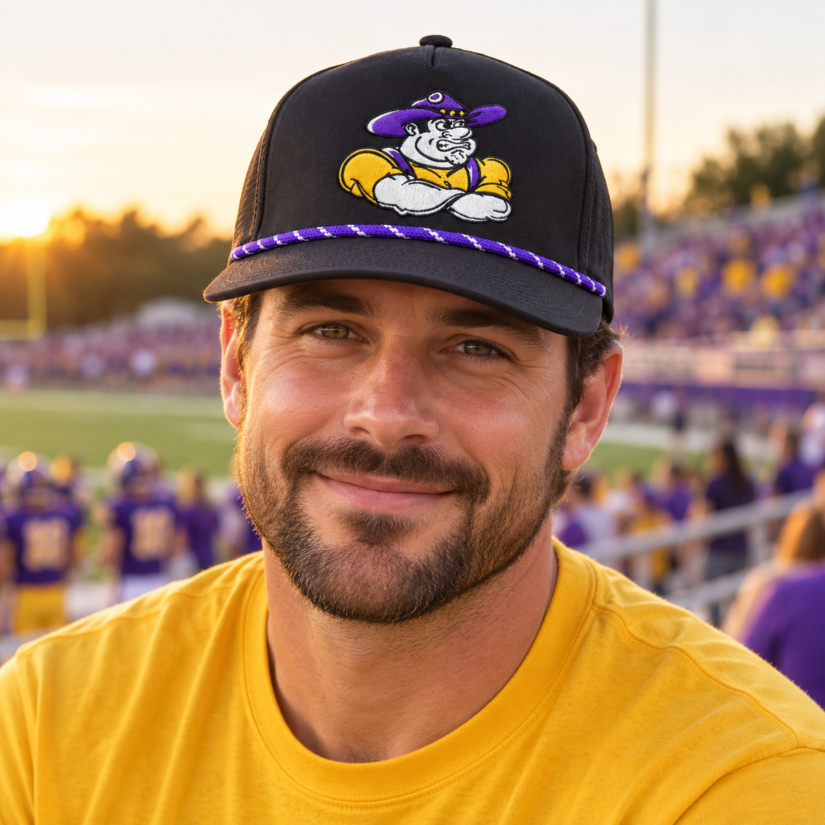 Adult fan wearing the Farmersville Luna Farmer Joe cap at a purple-and-gold game-day stadium — lifestyle mockup
